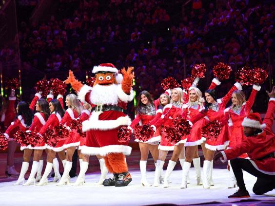 Gritty celebrating Christmas in Philadelphia with the Ice Girls (USA TODAY)