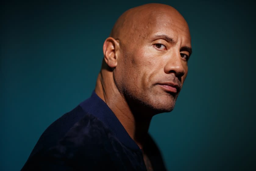 Dwayne Johnson poses for his new film