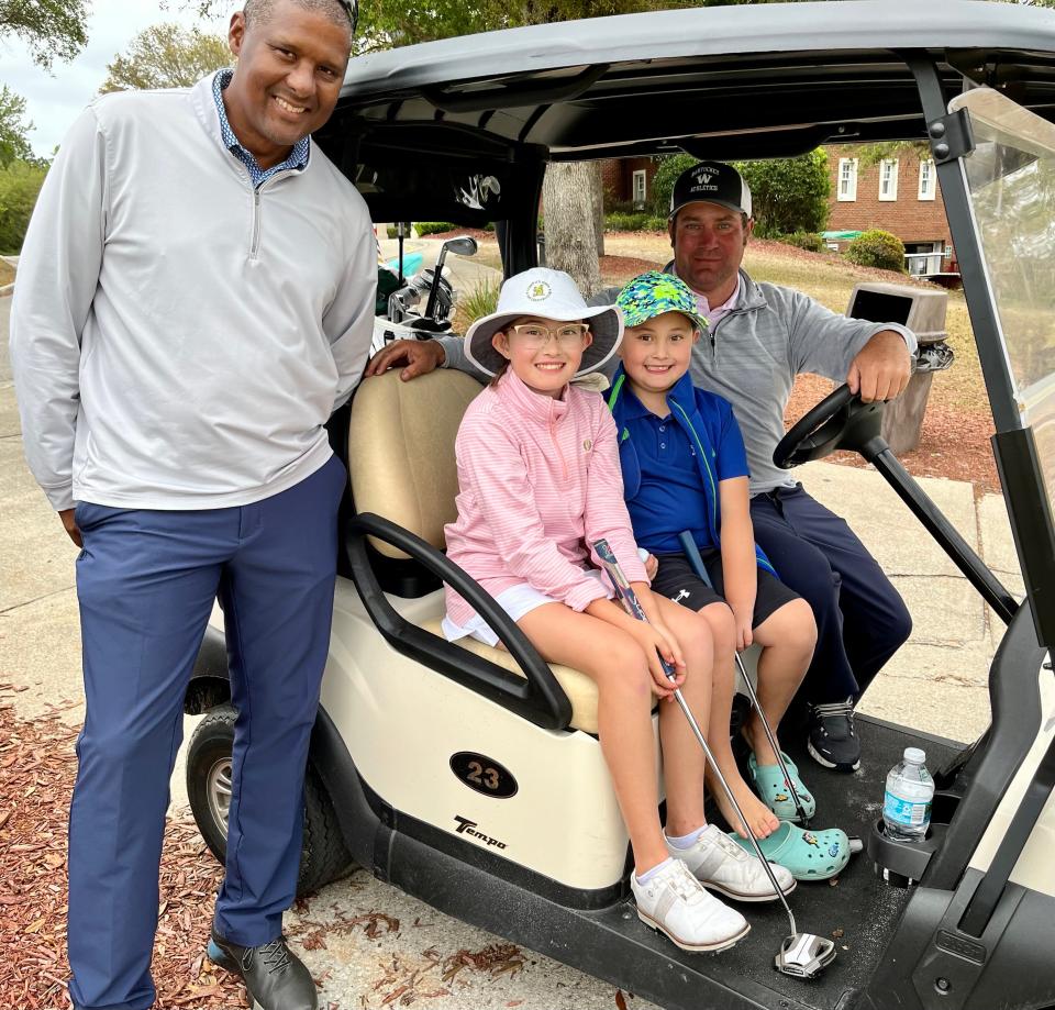 Lily Wachter (second from the left) has qualified for the Drive, Chip and Putt national finals. With her (from the left) are swing coach Robert Forde, her brother Kevin Wachter Jr., and her father Kevin Wachter Sr.
