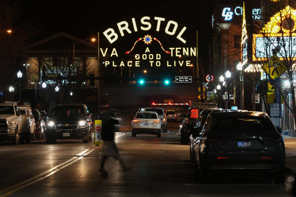 A sign straddling State Street in downtown Bristol displays the town's slogan, "A Good Place to Live." The imaginary line down State Street may cleanly divide the Appalachian town into Tennessee and Virginia, where abortion access radically differs. But residents' views on abortion are more complex.