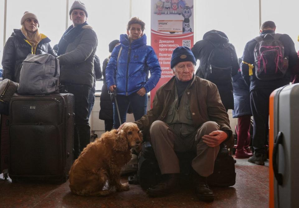 Violence in the capital causes thousands to flee the city on Tuesday, with at least 66,000 people leaving Ukraine altogether (REUTERS)