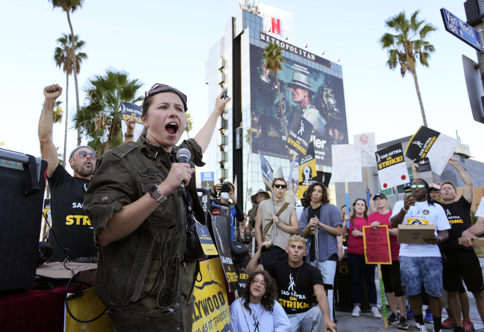 SAG-AFTRA captain Mary M. Flynn rallies fellow striking actors on a picket line outside Netflix studios, Wednesday, Nov. 8, 2023, in Los Angeles. (AP Photo/Chris Pizzello)
