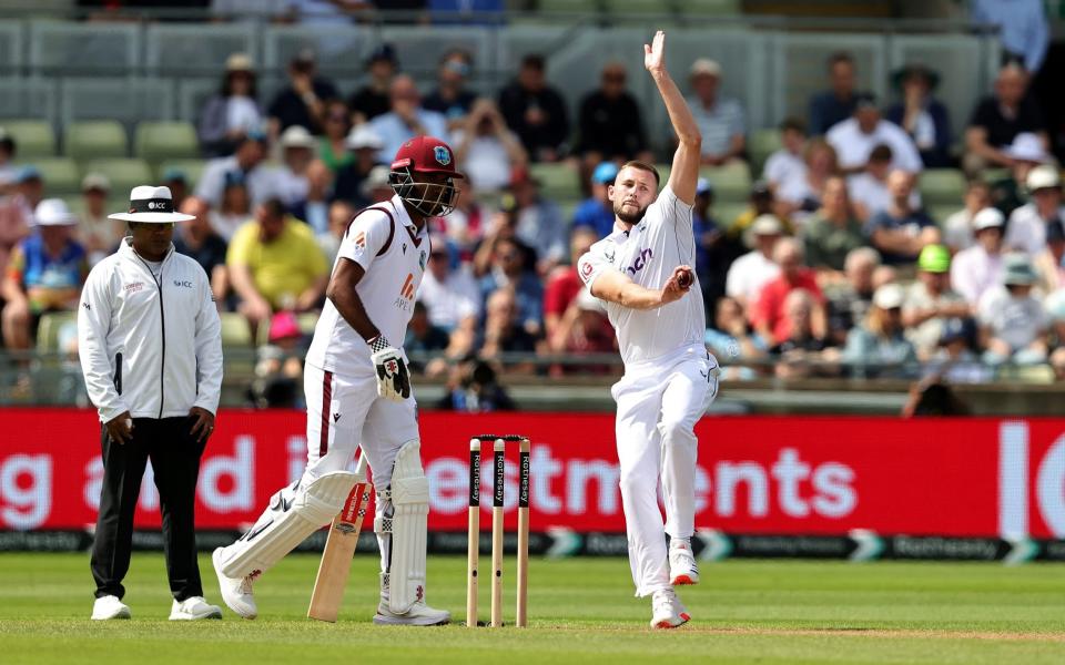 Gus Atkinson bowls on the first morning at Edgbaston