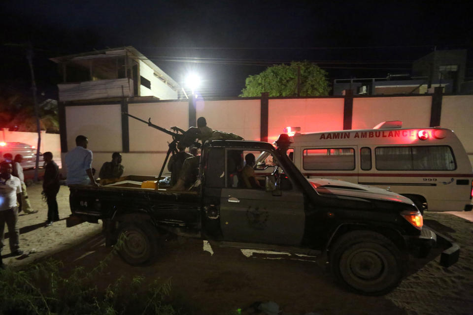 <p>Armed security forces and rescue personnel are seen at the scene of an attack outside an hotel in Mogadishu, Somalia, June 14, 2017. (Photo: Stringer/Reuters) </p>