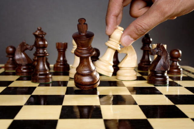 woman studying the next chess move, Stock image