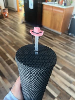 A set of cowboy straw toppers