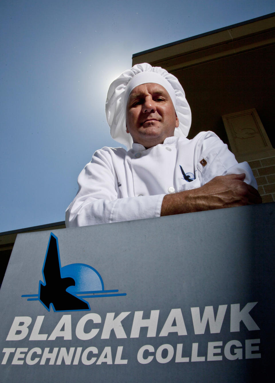 This Thursday, May 10, 2012 photo shows Mike Szlamczynski at the Blackhawk Tech College in Janesville, Wis. After 15 years on the Chrysler line, the autoworker took a buyout, returned to college at age 41 and studied to be a chef. He wanted financial security, no more layoffs, no more fears of losing it all. "I was tired of worrying," he says. "I had nothing to fall back on. If you have an education, that's something they can't take away from you. You have options. Before, I didn't have any options." On May 12, 2012, the man who dropped out of school 20 years ago after concentrating on fun more than work graduated from Blackhawk Technical College with an associate's degree in culinary arts and a 3.8 average _ "a huge accomplishment," he says. Most importantly, he left with a coveted commodity: a job as a cook at a casino-resort in New York state. (AP Photo/Morry Gash)