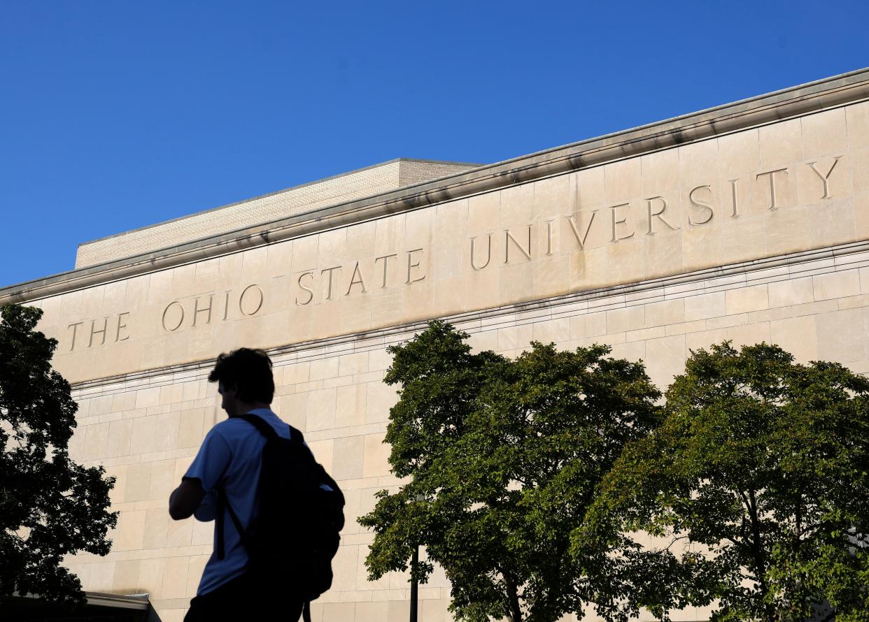 A student walks by Mershon Auditorium on Ohio State's Columbus campus on Sept. 21.