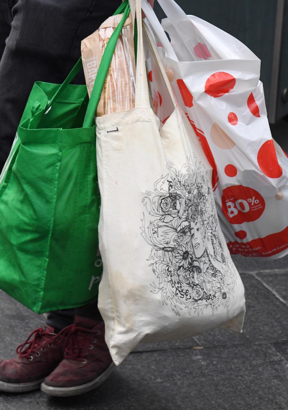 A shopper is seen carrying bags at a Coles Sydney CBD store, Sydney, Monday, July 2, 2018. 