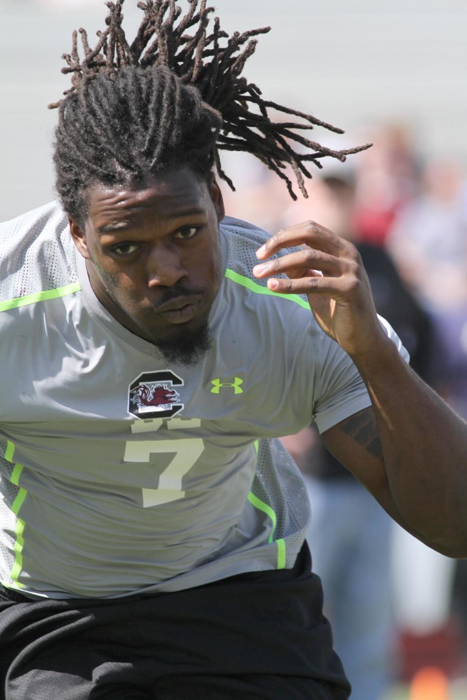 South Carolina defensive end Jadeveon Clowney competes in a drill for NFL representatives at South Carolina football pro day in Columbia, S.C., Wednesday, April 2, 2014. (AP Photo/Mary Ann Chastain)