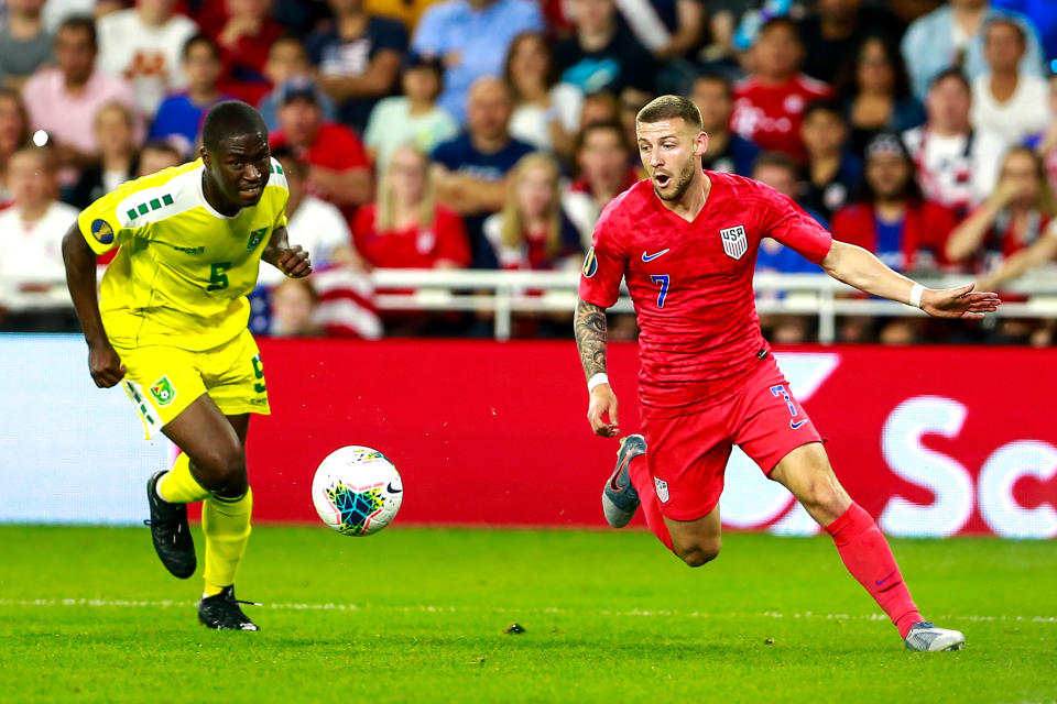 USA's midfielder Paul Arriola #7 (R) vies for the ball with Guyana's defender Ronayne Marsh-Brown #6 (L) during the 2019 CONCACAF Gold Cup Group D match between USA and Guyana on June 18, 2019 at Allianz Field in Saint Paul, Minnesota. (Photo by Kerem Yucel / AFP)        (Photo credit should read KEREM YUCEL/AFP/Getty Images)