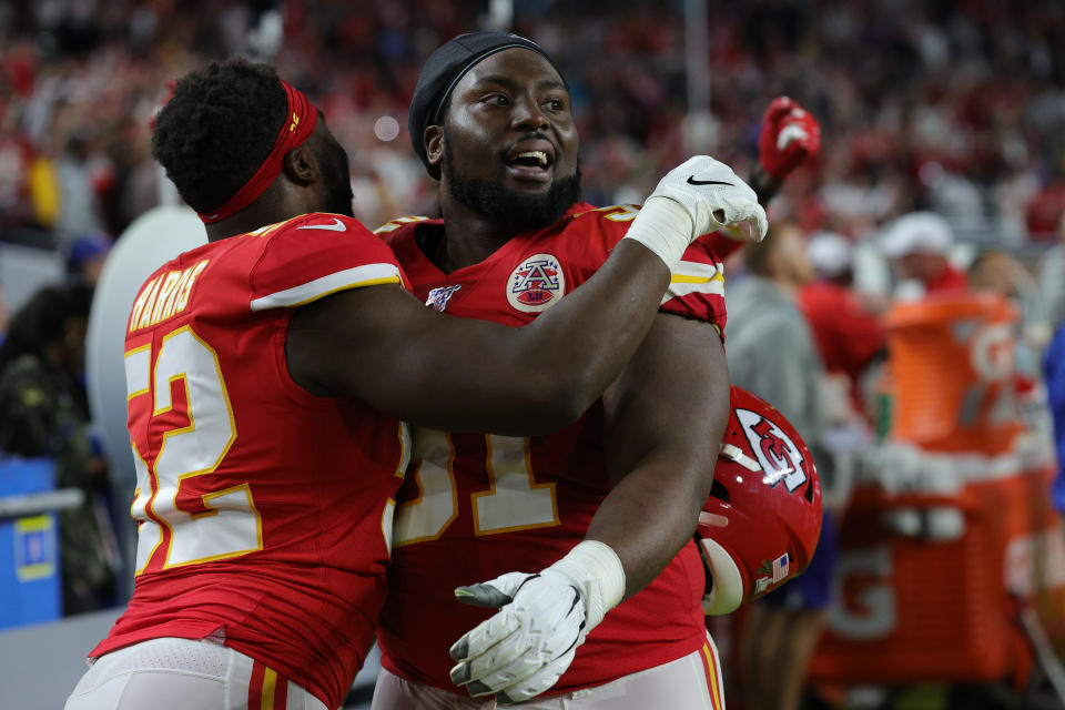 MIAMI, FLORIDA - FEBRUARY 02: Derrick Nnadi #91 of the Kansas City Chiefs celebrates with Demone Harris #52 after they defeated the San Francisco 49ers 31-20 in Super Bowl LIV at Hard Rock Stadium on February 02, 2020 in Miami, Florida. (Photo by Jamie Squire/Getty Images)