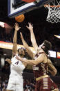 Virginia's Armaan Franklin (left) shoots over Boston College defenders during the second half of an NCAA college basketball game in Charlottesville, Va., Saturday, Jan. 28, 2023. (AP Photo/Mike Kropf)