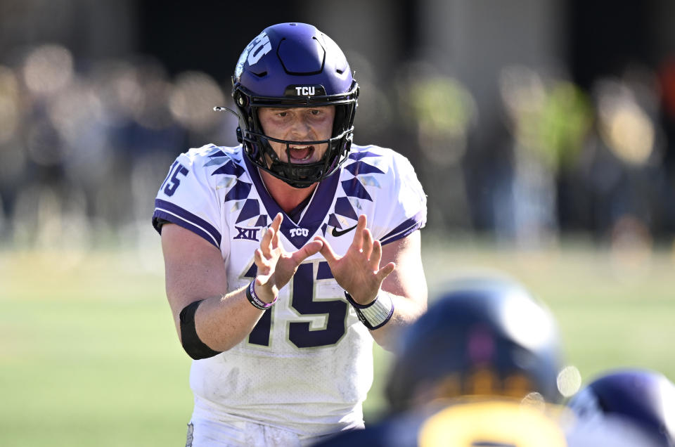 MORGANTOWN, WEST VIRGINIA - OCTOBER 29: Max Duggan #15 of the TCU Horned Frogs calls a play against the West Virginia Mountaineers at Mountaineer Field on October 29, 2022 in Morgantown, West Virginia. (Photo by G Fiume/Getty Images)