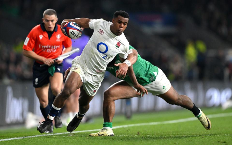 Immanuel Feyi-Waboso skips past an Ireland tackler