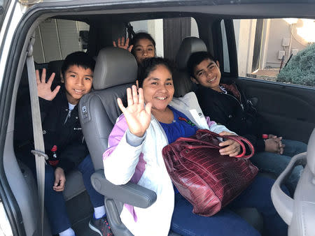 (L-R) Guatemalan asylum seekers Cesar, 11, Delia, 9, Amalia, 35, and Selby, 14, say goodbye after staying with the Aposolt family, a host family in Chandler, Arizona, U.S. in this November 16, 2018 handout photo. Courtesy of Apostol Family/Handout via REUTERS