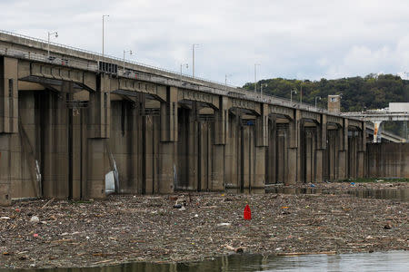 Garbage and debris pile up behind the Markland Locks and Dam on the Ohio River in Florence, Indiana, U.S., September 14, 2017. According the U.S. Army Corps of Engineers, Markland Locks’ construction started in March 1956 and the locks were placed in operation in May 1959. Photograph taken at N38°46.464' W84°57.836'. Photo taken September 14, 2017. REUTERS/Brian Snyder
