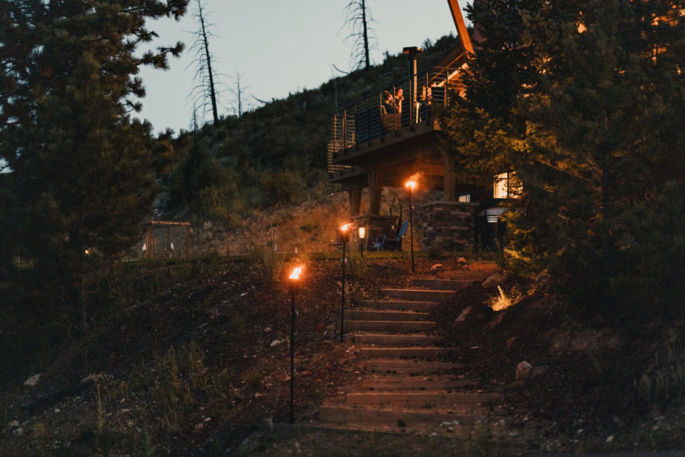 Torches illuminate an outdoor staircase.<p>Solo Stove</p>