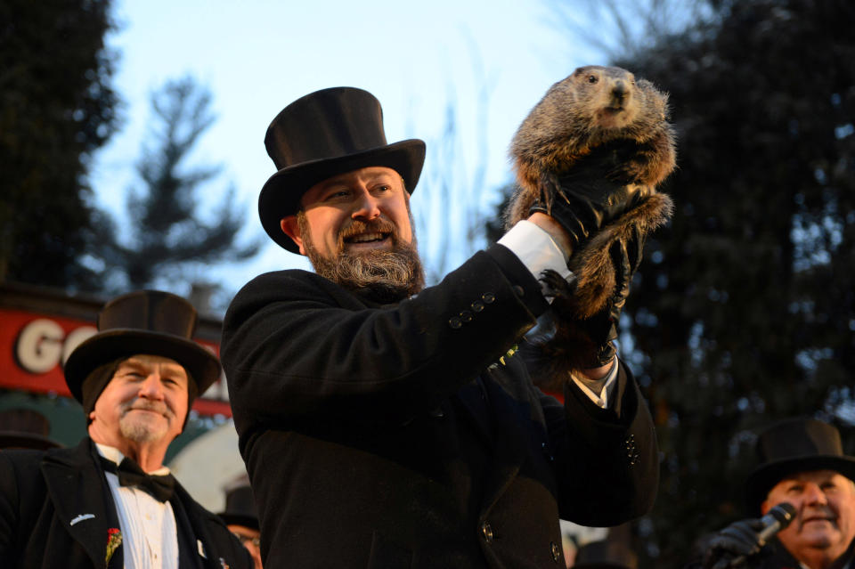 <p>Groundhog co-handler A.J. Derume holds Punxsutawney Phil at Gobbler’s Knob on the 132nd Groundhog Day in Punxsutawney, Pa., Feb. 2, 2018. (Photo: Alan Freed/Reuters) </p>