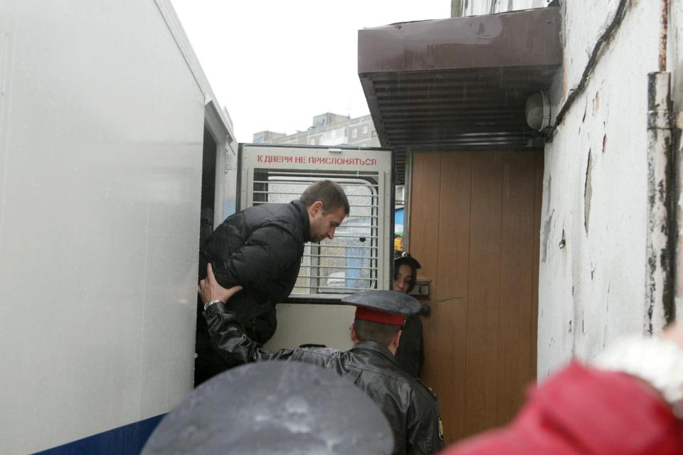 Greenpeace handout shows a Greenpeace International activist from Turkey arriving at court in Murmansk