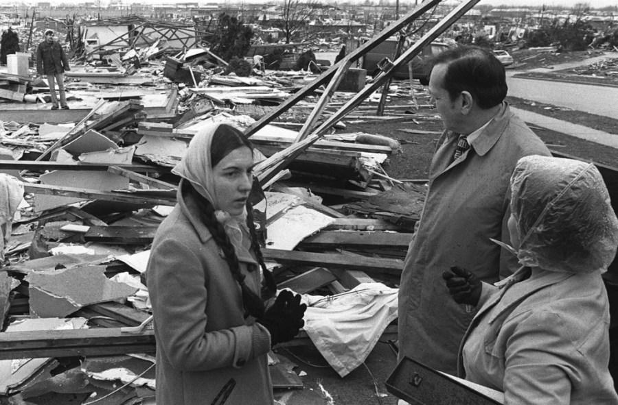 FILE – Sen. Robert Taft talks with people in the tornado ravaged area of Xenia, Ohio in this April 5, 1974 photo. The deadly tornado killed 32 people, injured hundreds and leveled half the city of 25,000. Nearby Wilberforce was also hit hard. As the Watergate scandal unfolded in Washington, President Richard Nixon made an unannounced visit to Xenia to tour the damage. Xenia’s was the deadliest and most powerful tornado of the 1974 Super Outbreak. (AP Photo, file)