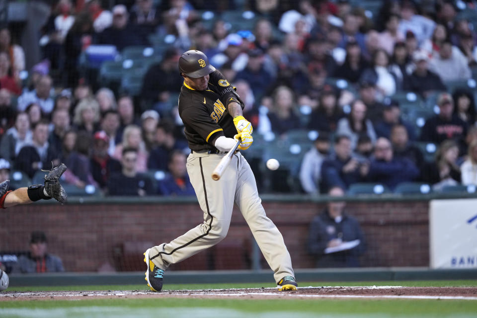 San Diego Padres' Manny Machado hits a single against the San Francisco Giants during the third inning of a baseball game in San Francisco, Friday, May 20, 2022. (AP Photo/Tony Avelar)