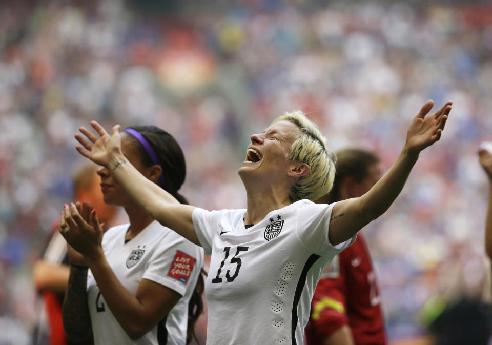 FILE - In this July 5, 2015, file photo, United States' Megan Rapinoe celebrates after the U.S. beat Japan 5-2 in the FIFA Women's World Cup soccer championship in Vancouver, British Columbia. The U.S. national team, ranked No. 1 globally, will try to defend its title in soccer’s premier tournament, which kicks off on June 7. (AP Photo/Elaine Thompson, File)