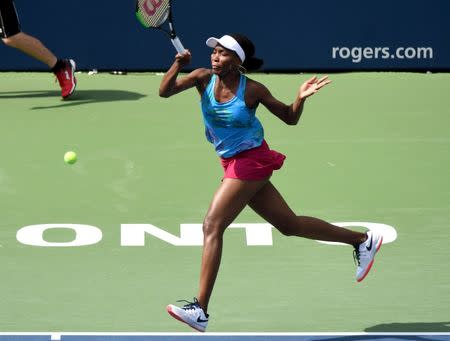 Aug 9, 2017; Toronto, Ontario, Canada; Venus Williams of the United States plays a shot against Katerina Siniakova of the Czech Republic (not pictured) during the Rogers Cup tennis tournament at Aviva Centre. Mandatory Credit: Dan Hamilton-USA TODAY Sports