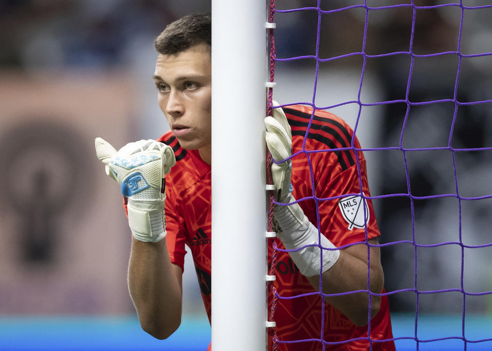 Chicago Fire goalkeeper Gabriel Slonina gestures to defenders on where to stand on a Vancouver Whitecaps free kick during the second half of an MLS soccer match Saturday, July 23, 2022, in Vancouver, British Columbia. (Darryl Dyck/The Canadian Press via AP)