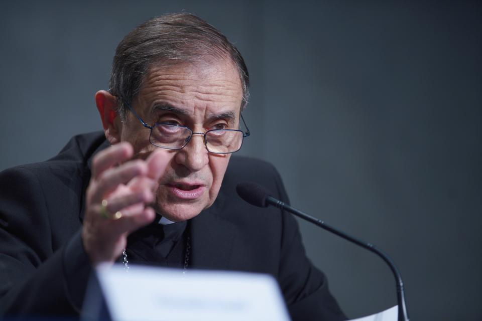 Mons. Juan Ignacio Arrieta talks to journalists during a press conference to present the new sex abuse law, at the Vatican's press room, Rome, Thursday, May 9, 2019. Pope Francis issued a groundbreaking law Thursday requiring all Catholic priests and nuns around the world to report clergy sexual abuse and cover-up by their superiors to church authorities, in an important new effort to hold the Catholic hierarchy accountable for failing to protect their flocks. (AP Photo/Andrew Medichini)