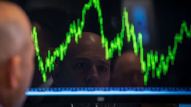 A Specialist trader watches his chart while working on the floor of the New York Stock Exchange July 8, 2014.