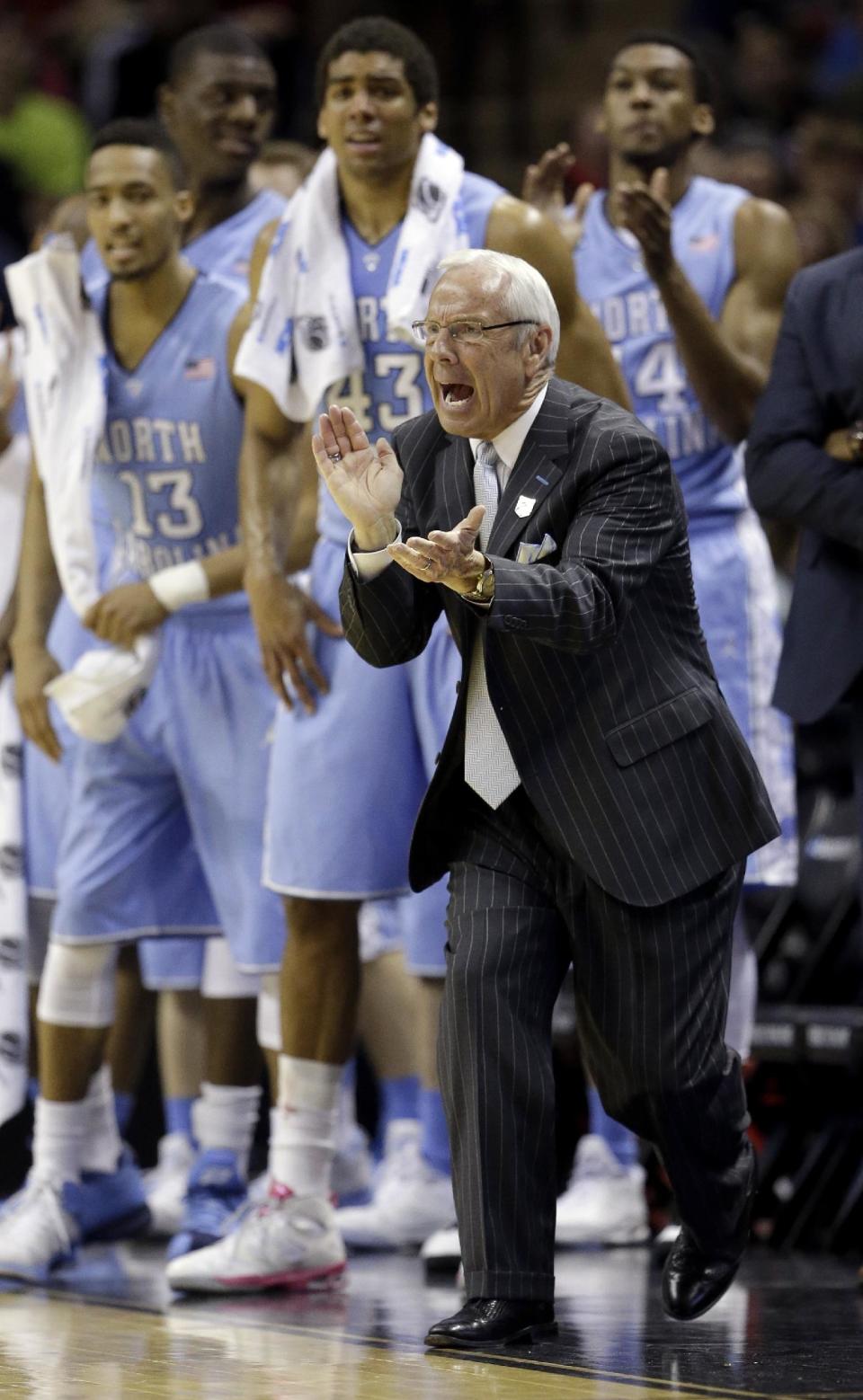 North Carolina coach Roy Williams encourages his players during the first half of a third-round game against Iowa State in the NCAA college basketball tournament Sunday, March 23, 2014, in San Antonio. (AP Photo/David J. Phillip)