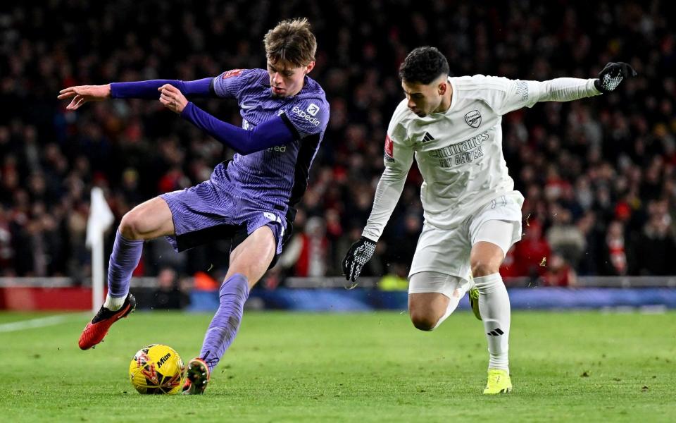 Conor Bradley of Liverpool takes on Gabriel Martinelli of Arsenal