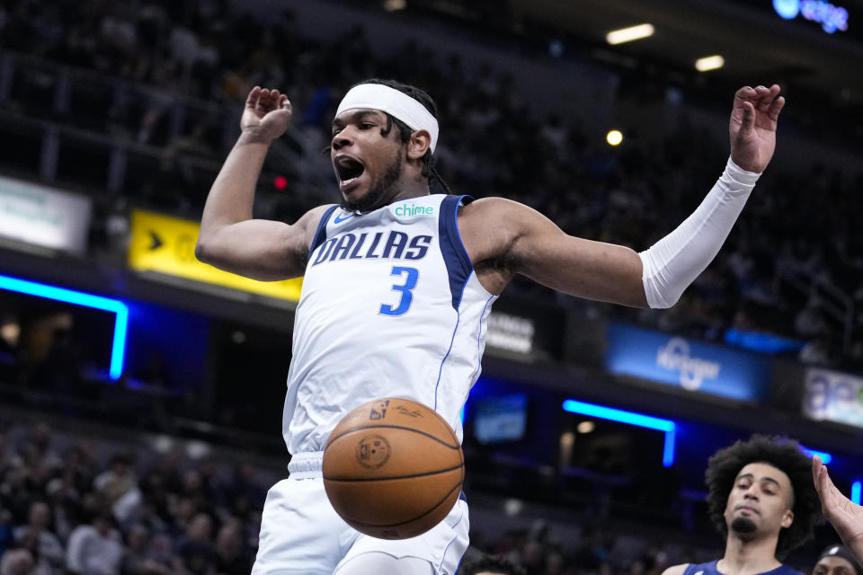 Dallas Mavericks guard Jaden Hardy (3) reacts after a dunk against the Indiana Pacers during the first half of an NBA basketball game in Indianapolis, Monday, March 27, 2023. (AP Photo/Michael Conroy)