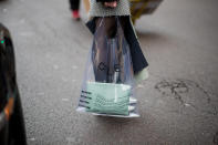 <p>Model carries a clear plastic Céline tote with mint clutch. (Photo: Getty Images) </p>