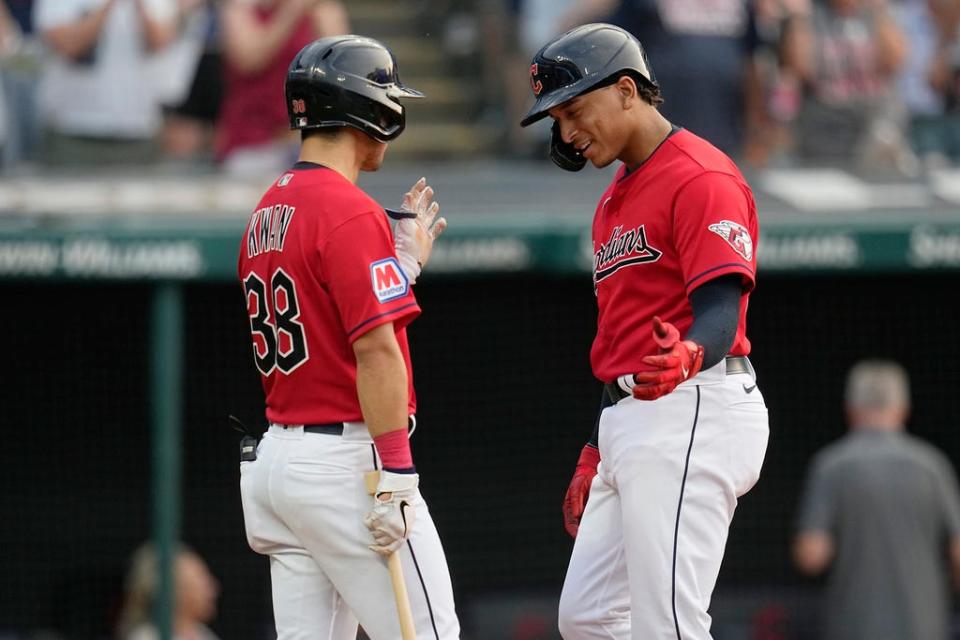 Cleveland Guardians' Bo Naylor, right, is congratulated by Steven Kwan (38) after his home run against the Kansas City Royals during the third inning Tuesday in Cleveland.