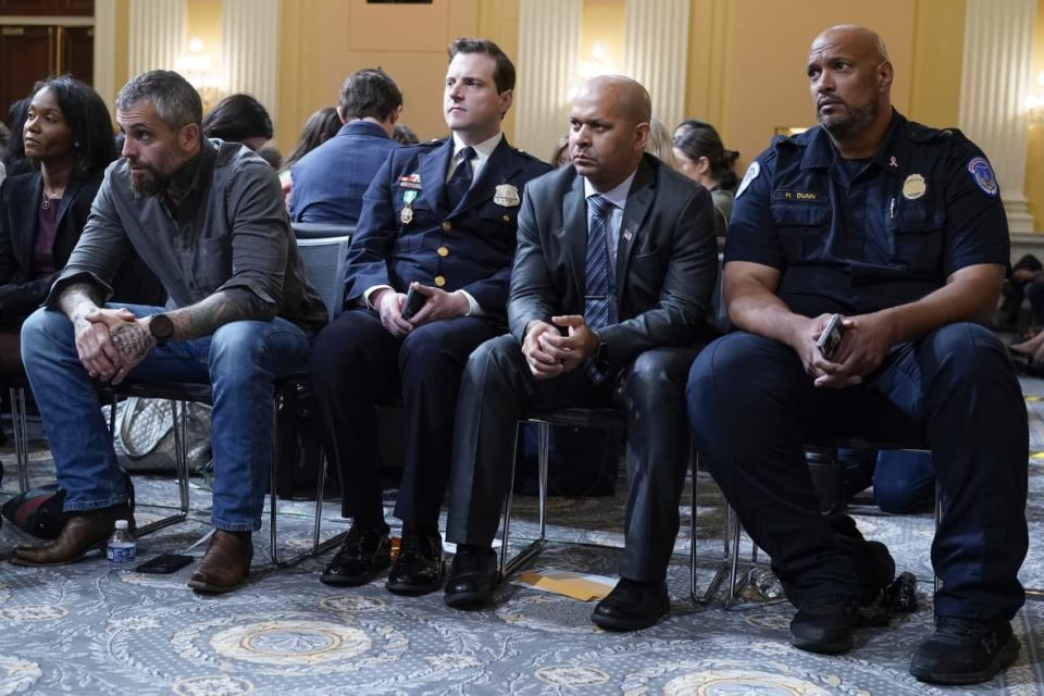 (L to R )Serena Liebengood, widow of U.S. Capitol Police officer Howie Liebengood, former Washington Metropolitan Police Department officer Michael Fanone, Washington Metropolitan Police Department officer Daniel Hodges, U.S. Capitol Police Sgt. Aquilino Gonell and U.S. Capitol Police Sgt. Harry Dunn listen on Oct. 13, 2022 during a hearing of the House select committee investigating the Jan. 6, 2021 attack on the U.S. Capitol. Top House and Senate leaders presented law enforcement officers who defended the Capitol with Congressional Gold Medals, the highest honor of that body. (AP Photo/Jacquelyn Martin, File)