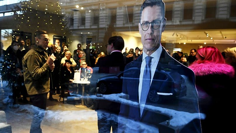 A cut-out of National Coalition Party (NCP) presidential candidate Alexander Stubb is seen in the window of a cafe as he campaigns in Helsinki, Finland, Thursday, Jan. 11, 202