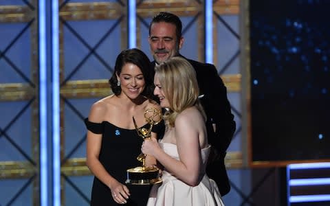 Elisabeth Moss accepting her Emmy from Jeffrey Dean Morgan and Tatiana Maslany - Credit: Getty