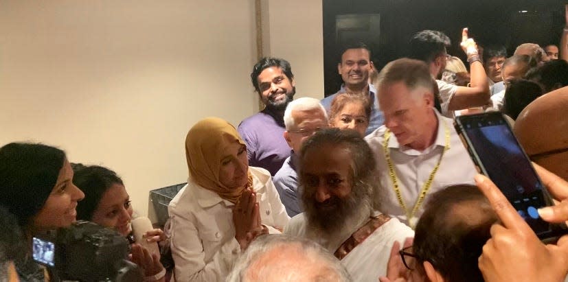 Gurudev Sri Sri Ravi Shankar walks through a line of supporters of diverse backgrounds  after his talk at Orchestra Hall in Detroit on August 22, 2023.