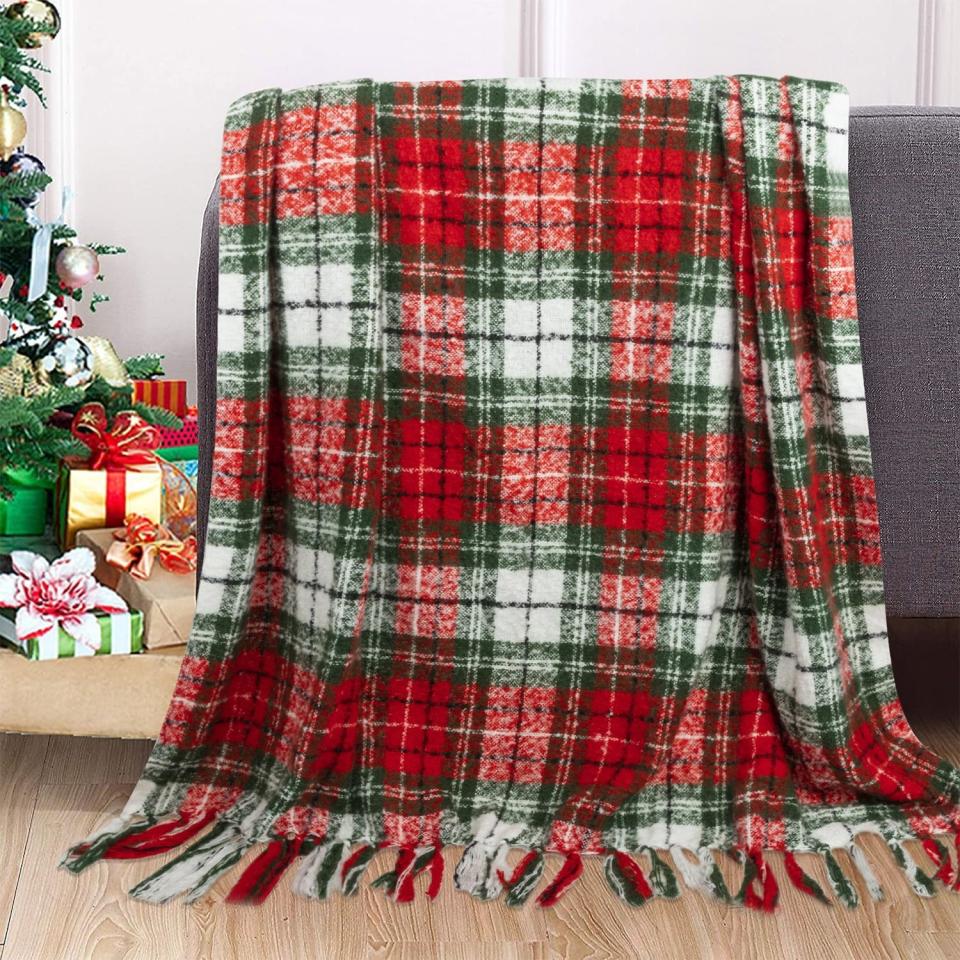 <p><a href="https://go.redirectingat.com?id=74968X1596630&url=https%3A%2F%2Fwww.walmart.com%2Fip%2FChristmas-Home-Decorations-Super-Soft-Fluffy-Plaid-Throw-Blanket-with-Fringe-50-x-60%2F682099447&sref=https%3A%2F%2Fwww.thepioneerwoman.com%2Fholidays-celebrations%2Fg45211938%2Fwalmart-christmas-decorations%2F" rel="nofollow noopener" target="_blank" data-ylk="slk:Shop Now;elm:context_link;itc:0;sec:content-canvas" class="link ">Shop Now</a></p><p>Christmas Plaid Throw Blanket</p><p>walmart.com</p><p>$26.99</p><span class="copyright">Walmart</span>