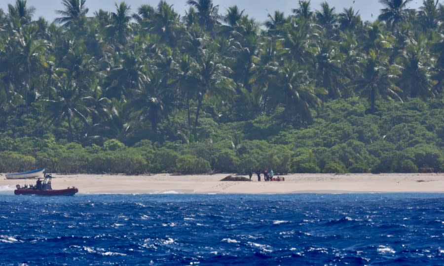 The crew of USCGC Oliver Henry (WPC 1140) make contact with three mariners stranded on Pikelot Atoll, Yap State, Federated States of Micronesia, on April 9, 2024. Watchstanders at Joint Rescue Sub-Center Guam received a distress call from a relative of the three mariners on April 6, 2024, reporting her three uncles departed Polowat Atoll, Chuuk State, Easter Sunday for Pikelot Atoll, approximately 100 nautical miles northwest and had not returned, prompting the search. (U.S. Coast Guard photo)