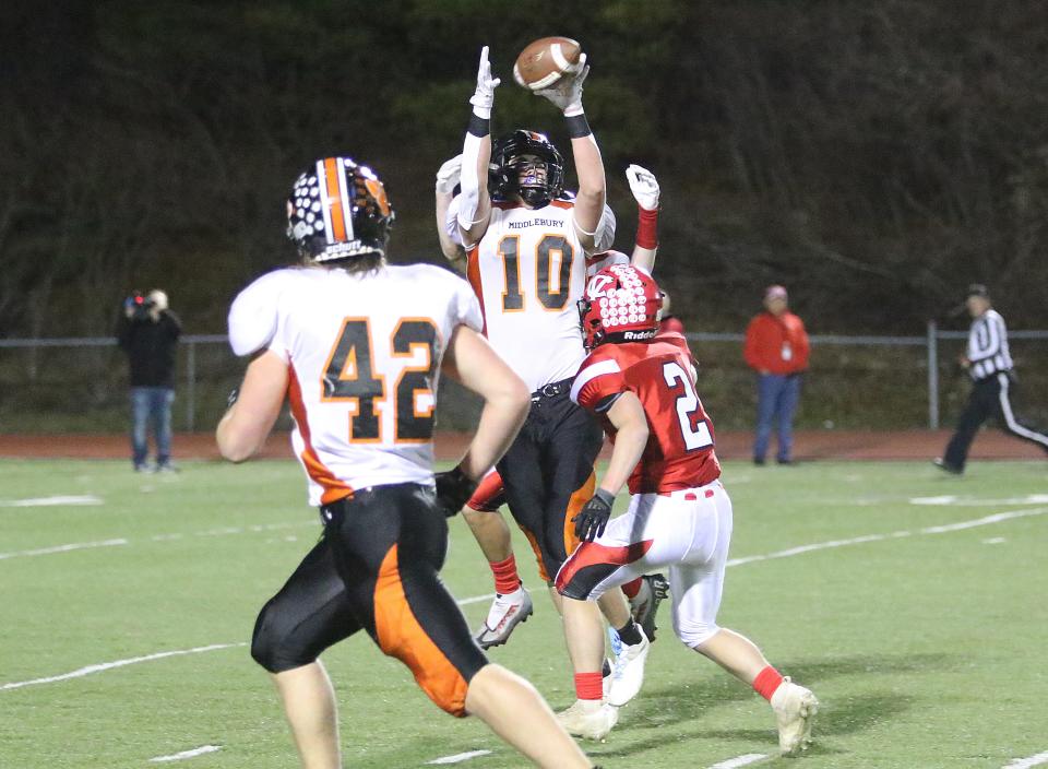 Middlebury's Penn Riney hauls in a pass during the Tigers 24-19 loss to CVU in the Division I state championship game at Rutland High School.