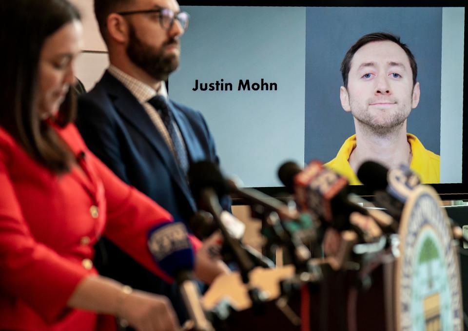 Bucks County District Attorney Jen Schorn, left, speaks to the media alongside Chief Deputy District Attorney - Chief of Child Abuse Prosecution, Matthew S. Lannetti, center, and other law enforcement partners while showing the mugshot of Justin Mohn in the background at the press conference about the Mohn murder case at the Bucks County Justice Center in Doylestown on Friday, Feb.2, 2024. 

Daniella Heminghaus | Bucks County Courier Times