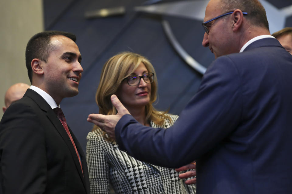 Italy's Foreign Minister Luigi di Maio, left, talks to Croatia's Foreign Minister Gordan Grlic, right, and Bulgaria's Foreign Minister Ekaterina Zaharieva during a NATO Foreign Ministers meeting at the NATO headquarters in Brussels, Wednesday, Nov. 20, 2019. (AP Photo/Francisco Seco)