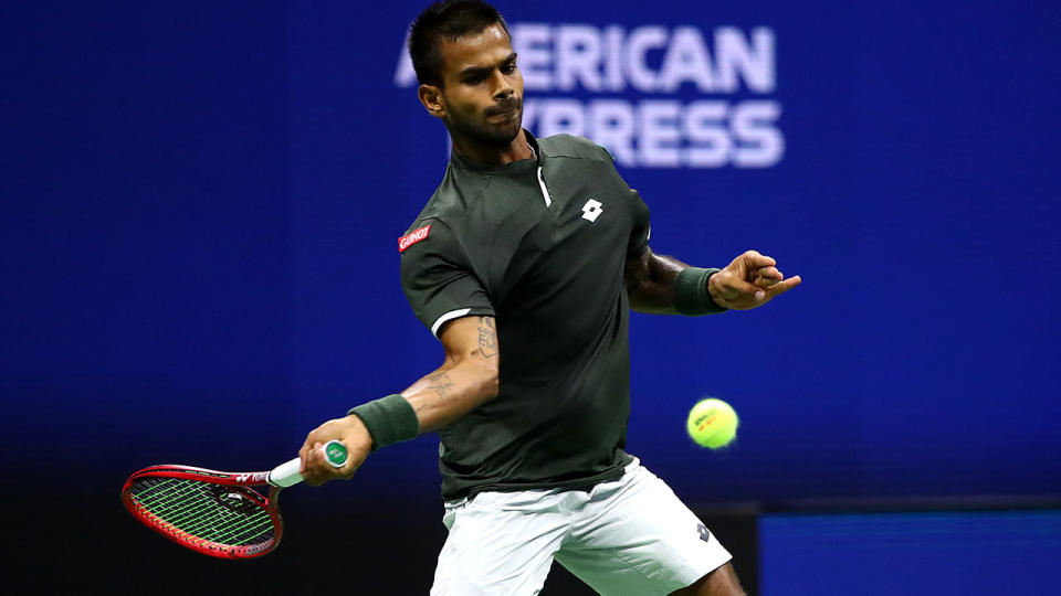 Sumit Nagal, pictured here in action against Roger Federer.