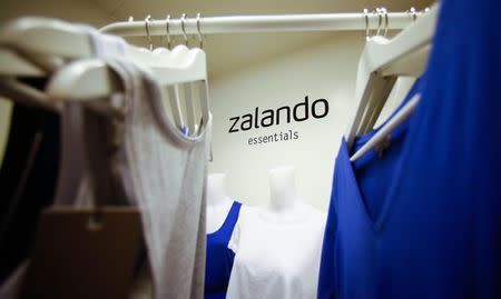 A Zalando logo is printed on a wall in a showroom of the fashion retailer Zalando in Berlin October 14, 2014. REUTERS/Hannibal Hanschke