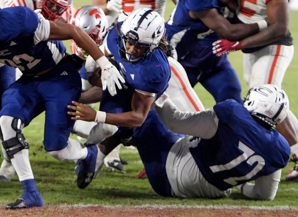 Clay-Chalkville's Jaylen Mbakwe (9) dives into the end zone for a touchdown against Saraland during the AHSAA Class 6A football state championship game at Bryant Denny Stadium in Tuscaloosa, Ala., on Friday December 8, 2023.