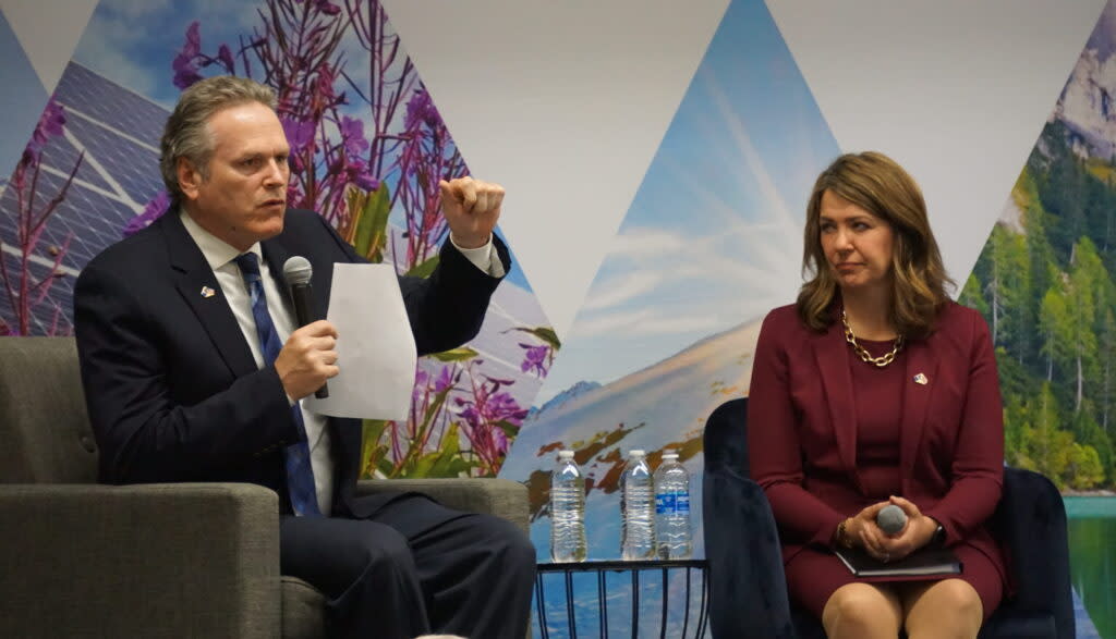 Gov. Mike Dunleavy speaks about his vision for Alaska's energy future at the Connecting the Arctic conference held in Anchorage on May 20, 2024. Next to him is Alberta Premier Danielle Smith. (Photo by Yereth Rosen/Alaska Beacon)