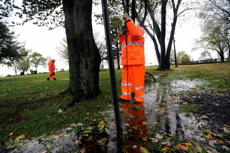 Baltimore Gas and Electric (BGE) workers look for access points to check on gas lines in Havre de Grace, Md. as the aftermath of superstorm Sandy continues to disrupt routines on the East Coast Tuesday, Oct. 30, 2012. (AP Photo/Steve Ruark)